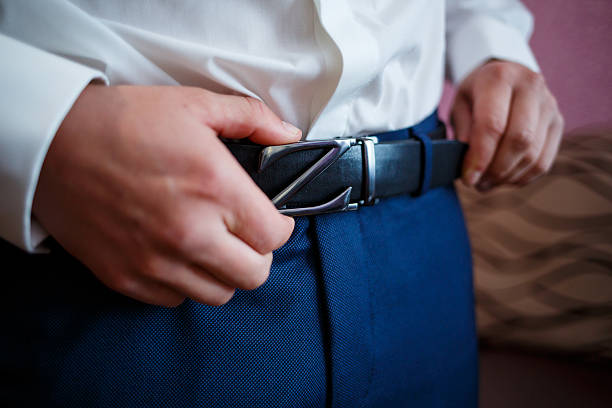 istock man puts on a suit on the wedding day 2248812315