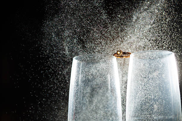 istock Gold wedding rings with water splashes 2248812905