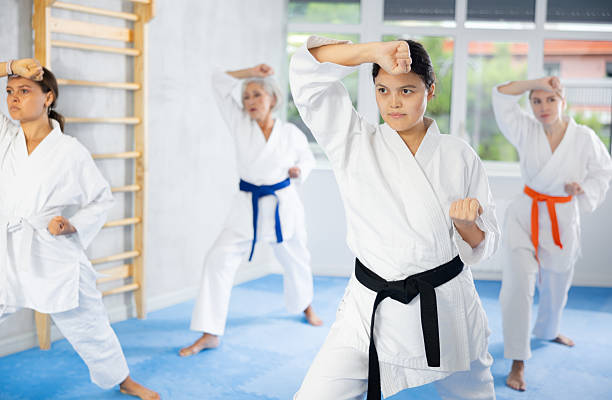 istock Athletes have starting position and repeating sequence of punches and painful techniques in kata 2248814672