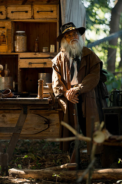 istock A senior cowboy aiming rifles in a forest camp 2248815867