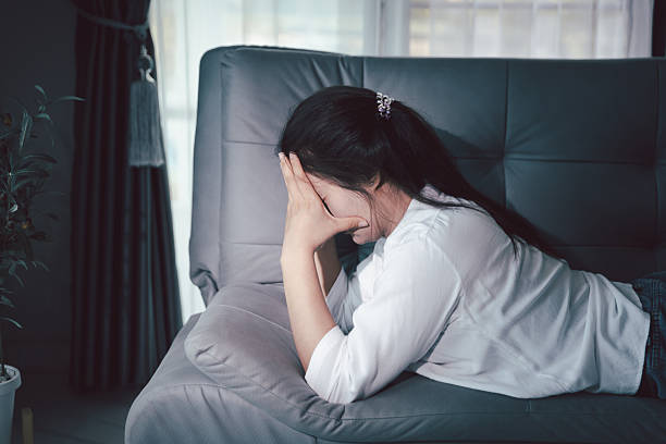 istock Sorrowful woman sat alone, overwhelmed by emotion, her sad and unhappy expression revealing deep despair, stress and distress left feeling depressed. sorrowful sad, despair alone, depressed stress 2248815962