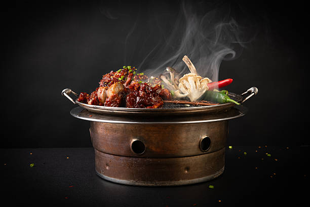 istock Steaming Hot Braised Meat Dish on Rustic Grill 2248816717