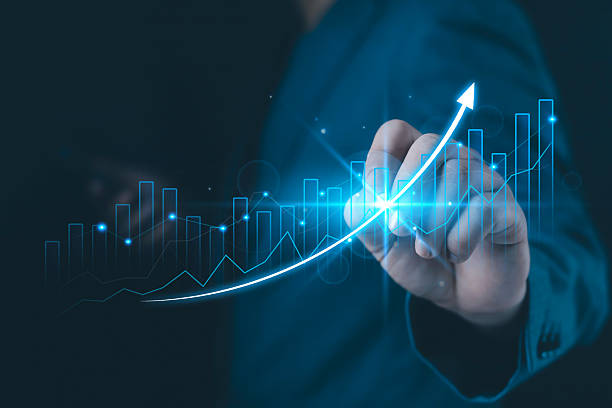 istock A business hand drawing a glowing upward curve with digital charts and data lines, symbolizing financial growth, analytics, performance improvement, future success, and strategic business development. 2248818001