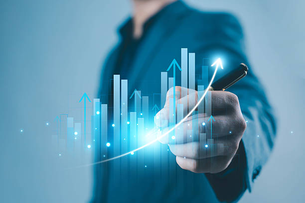 istock A business hand drawing a glowing rising graph with digital bars and arrows, symbolizing financial growth, data analytics, success, performance improvement, and modern business strategy in a digital 2248818002