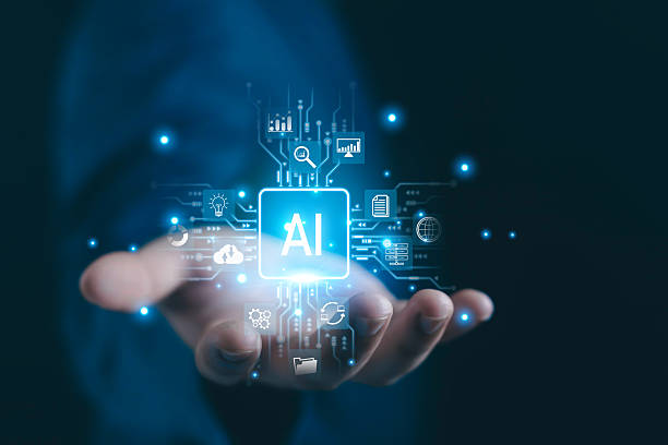 istock A futuristic concept of artificial intelligence showing a glowing AI icon floating above a business hand, surrounded by digital technology symbols representing innovation, analytics, cloud computing, 2248818003