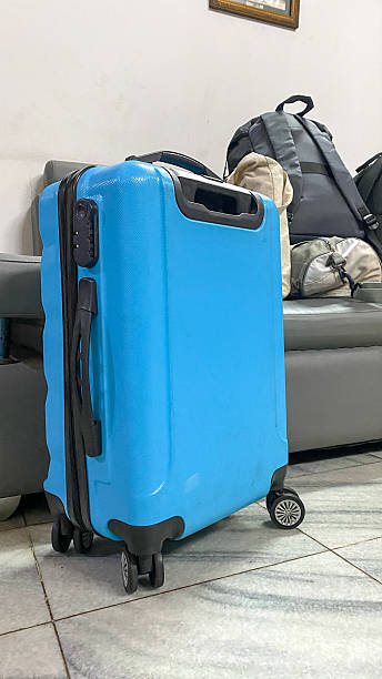 istock Packed luggage in living room 2248818325