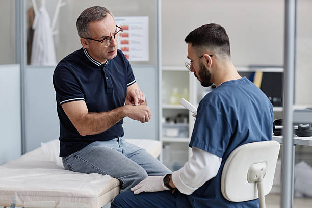 istock Caucasian Middle Aged Man Discussing Skin Concern with Male Dermatologist 2248819969