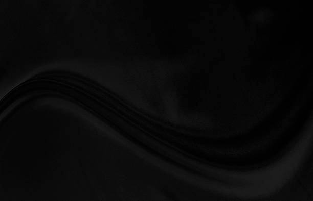 istock Black gray satin dark fabric texture luxurious shiny that is abstract silk cloth background with patterns soft waves blur beautiful. 2248822465