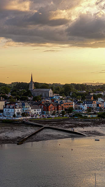 istock Aerial view of Malahide town at sunset featuring St. Sylvester’s Church with spire, surrounded by colorful Georgian houses and lush greenery, Irish coastal townscape with historical and religious architecture, Travel and heritage concept 2248823607