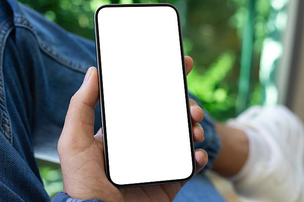 istock man hand hold phone with isolated screen background jeans cafe 2248825012