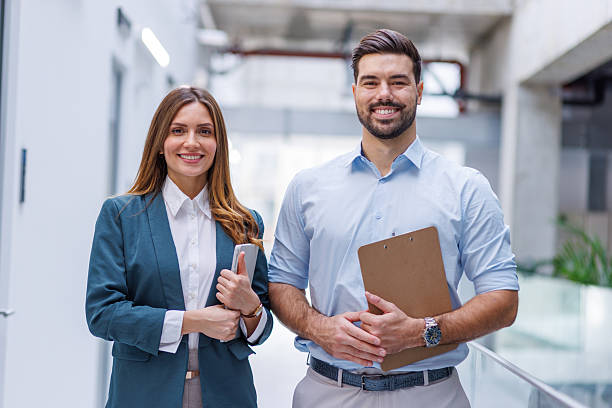 istock Business colleagues smiling confident in professional office environment 2248826549