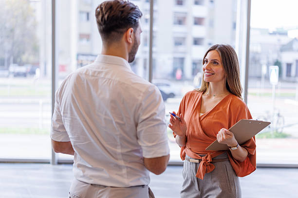istock Business colleagues discussing work in modern office building 2248826939