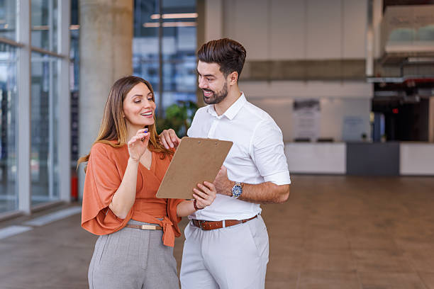 istock Business partners discussing project details on clipboard in office 2248826952