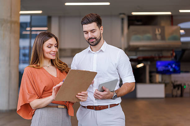 istock Business colleagues collaborating on project, discussing documents in modern office 2248827033