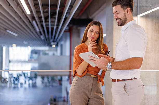 istock Business colleagues collaborating on digital tablet in modern office 2248827195
