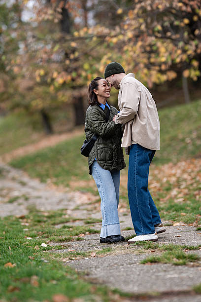 istock Happy interracial couple enjoying romantic date in park 2248827947