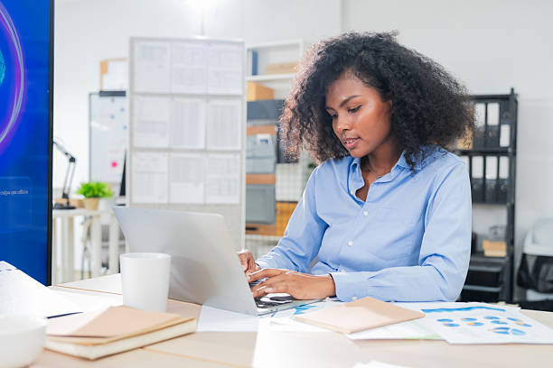 istock Business professional concentrates in coworking space leveraging AI powered virtual assistant and realtime big data analytics on laptop display for hyper automated workflow intelligence optimization 2248828291
