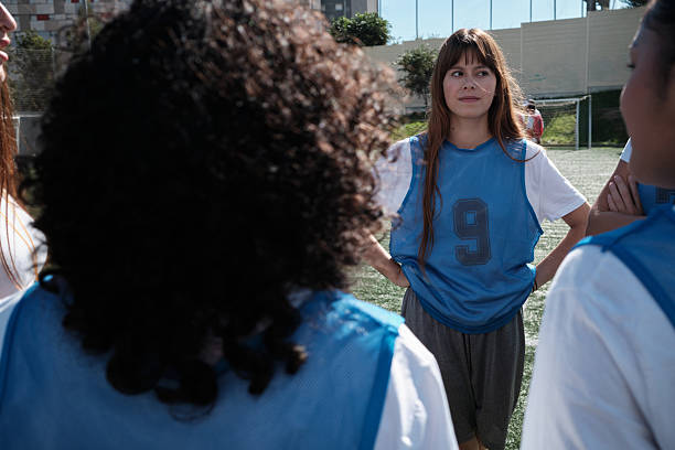 istock Female soccer players in team huddle discussing strategy 2248830353