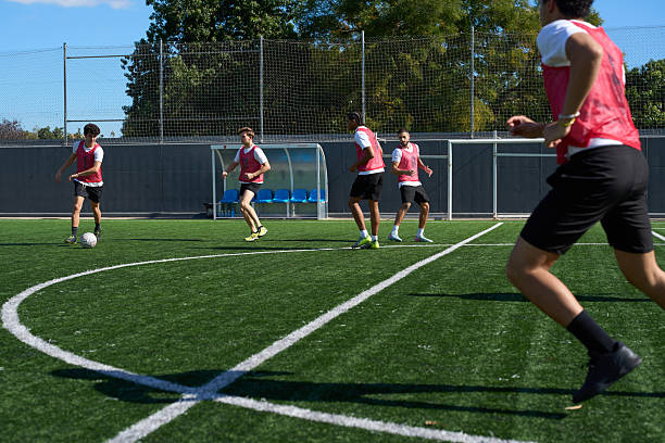 istock Young men playing soccer on artificial turf field 2248830561