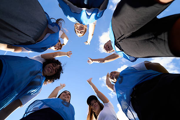 istock Women's sports team celebrating victory in huddle 2248830653