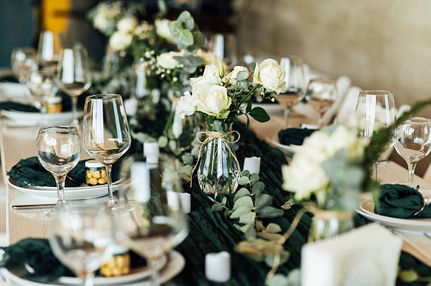 istock Elegant festive table setting with green decor and glassware 2248830668