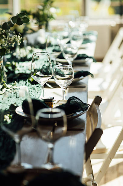 istock Elegant festive table setting with green decor and glassware 2248830733