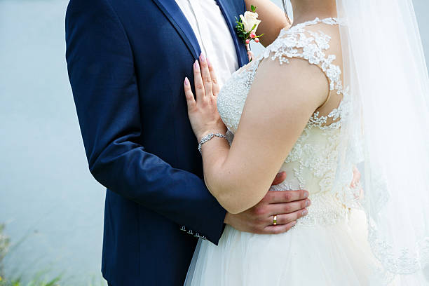 istock Bride cuddle with groom on wedding day 2248832557