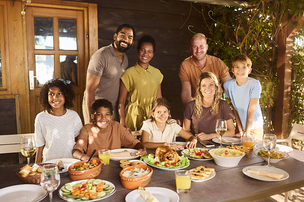 istock Happy families enjoying while having lunch on a patio. 2248833896