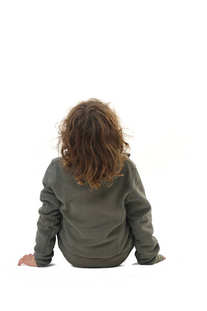 istock back view of  boy dressed in sportswear on a white background 2248835227