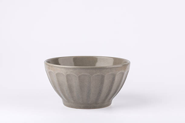 istock Front view of gray ceramic bowl with vertical texture on white background, minimalist and elegant style with copy space. Concept of modern home decor and calm lifestyle 2248837207