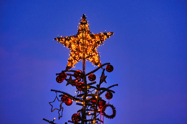 istock Top of a Christmas tree against blue sky 2248838805