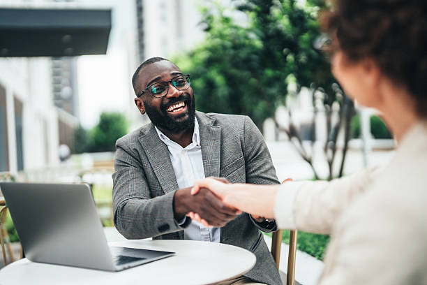 istock Successful business agreement sealed with a handshake in cafe 2248841372