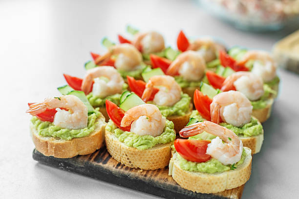 istock Shrimp avocado bruschetta appetizer with tomato and cucumber 2248850163