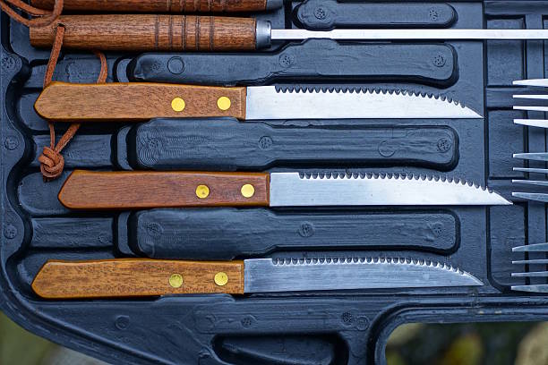 istock a row of three old knives with brown handles 2248850488