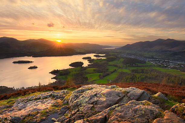 A view of Derwentwater and Keswick seen from Walla Crag summit on a dramatic summer sunset. Lake District, England, UK.