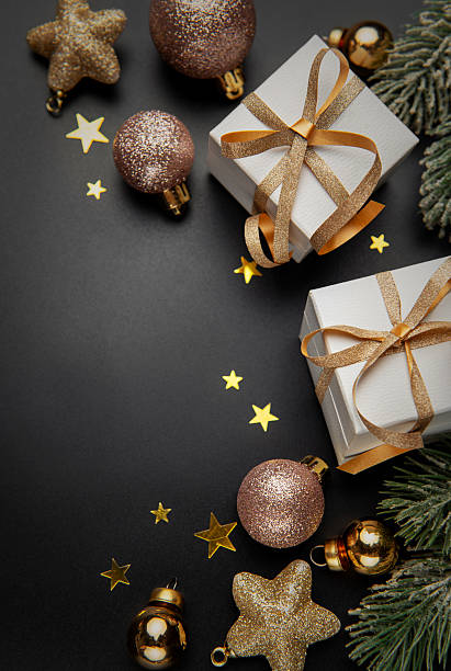 istock Christmas gifts and ornaments on black background 2248853210