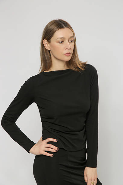 istock Female model wearing comfortable basic smart casual black viscose boat neckline shirt 2248853584