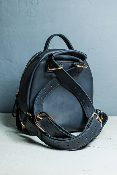 istock Women's leather black backpack on the shoulder. Handmade leather backpack. 2248854637
