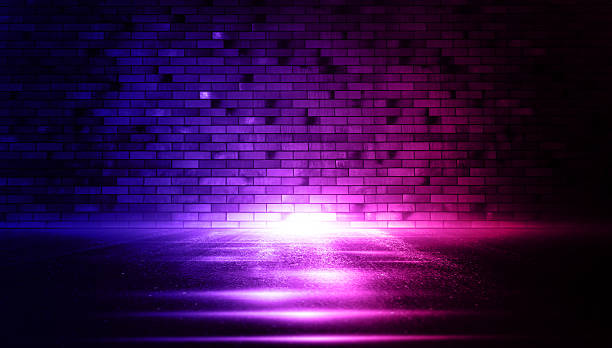 istock Rays neon light on neon brick wall. Empty scene. Neon reflections on wet asphalt. Cyberpunk background with copy space. 2248855241