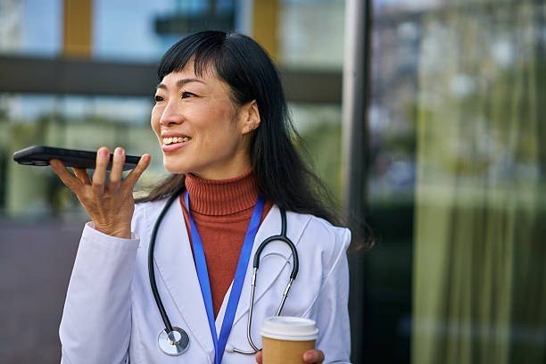 istock Asian doctor talking on phone with coffee 2248856352