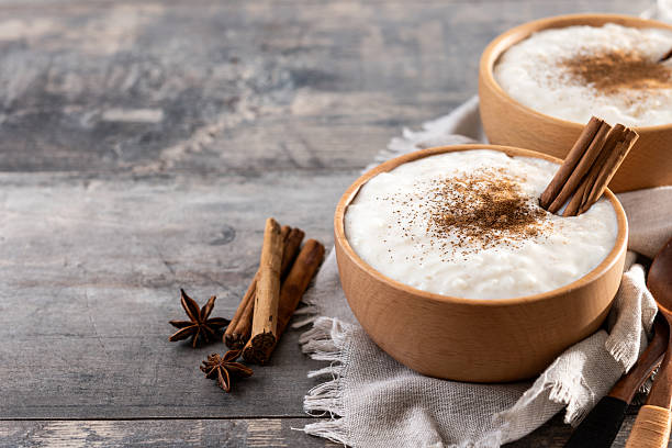 istock Rice pudding with cinnamon in wooden bowl 2248861743