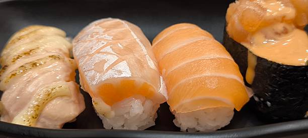 istock Sushi on a black plate Japanese food 2248864984