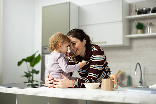 istock Mother and toddler bonding in kitchen 2248865993
