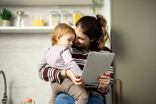 istock Mother and toddler looking at tablet together 2248866024