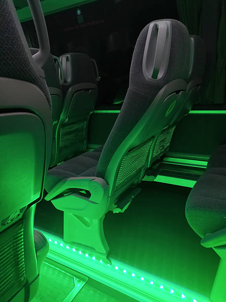 istock Modern bus interior with comfortable seating and ambient green lighting. Evokes travel, safety, and technology. Great for transport, design, or futuristic concepts. 2248868358