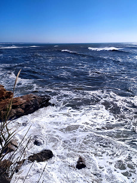 istock Dramatic ocean view with waves crashing against rocks. A powerful scene embodying strength, natures force, and the allure of the sea. Perfect for travel, adventure, or environmental themes. 2248868372