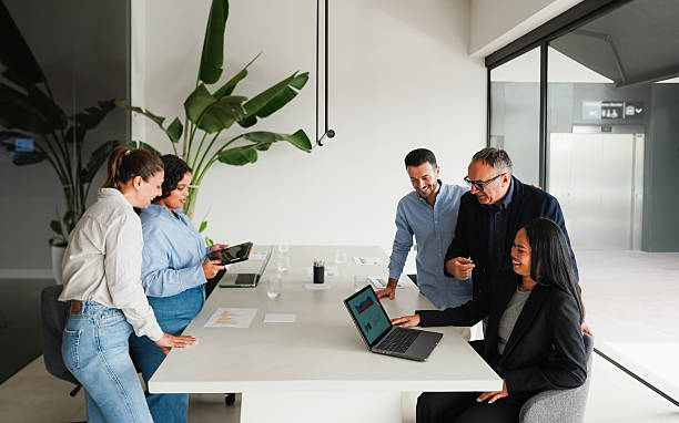 istock Multigenerational business people sharing ideas inside company office - Multiracial colleagues discussing new financial project - Brainstorming and corporate concept - Main focus on senior man face 2248868670
