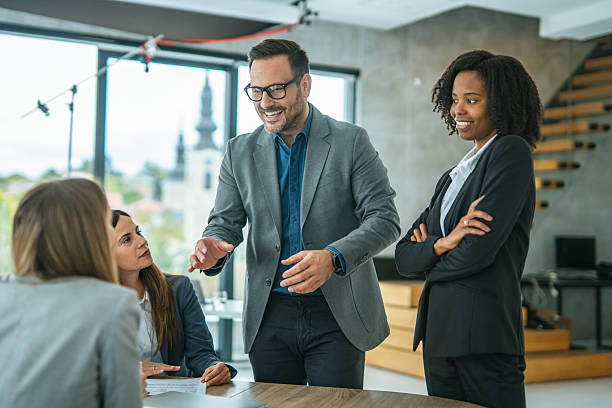 istock Business professionals collaborating at a corporate office meeting 2248869645