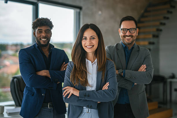 istock Diverse business team smiling with arms crossed in modern office 2248869671