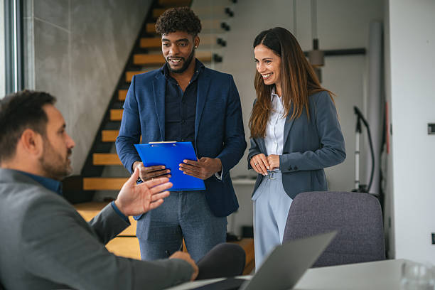 istock Business people discussing document during office meeting 2248869720